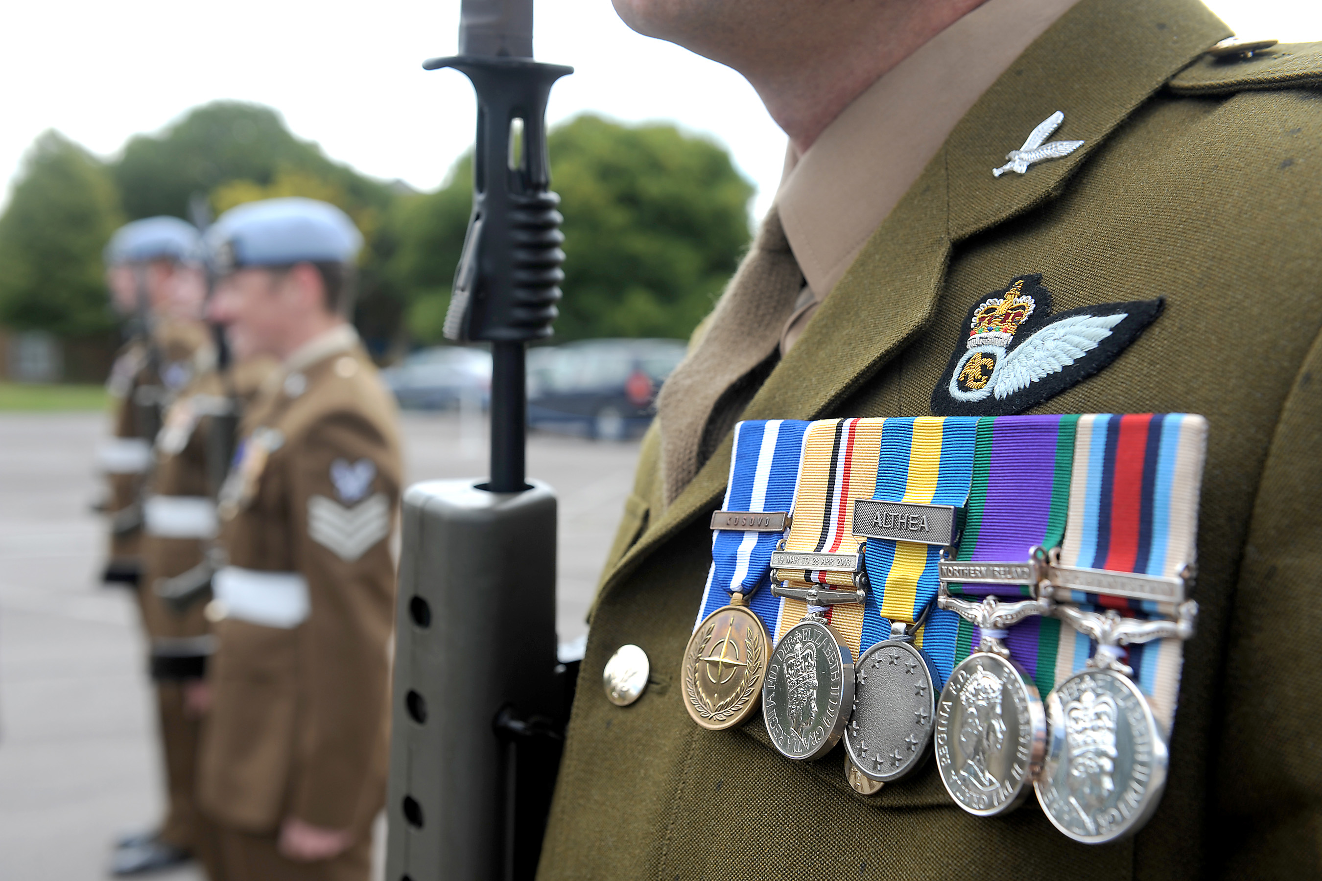 Previously lost army military Medals hang from uniform.